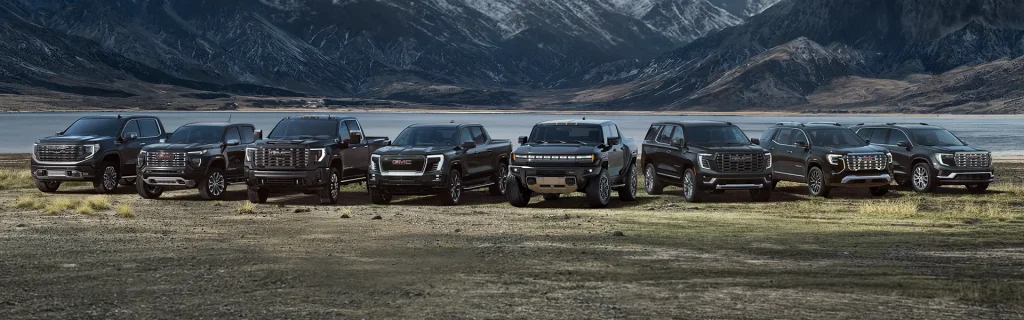 Bridgeton GMC vehicle lineup including trucks and SUVs in mountain landscape.