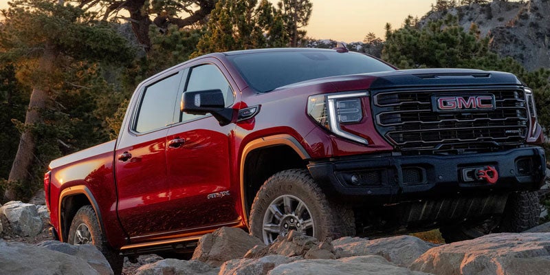2026 GMC Sierra 1500 standing by stone landscape outdoors